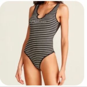 Bebe Crystal Logo striped lace back bodysuit